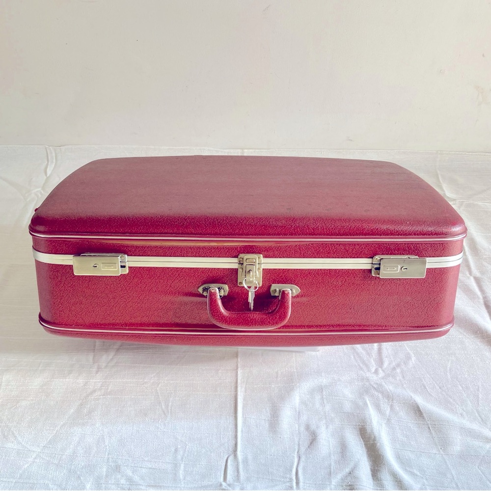 Vintage red hard shell suitcase